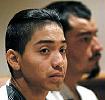 Illegal aliens Julio C Alvarez, front, and Carlos O Martinez listen to their arraignment proceedings through the use of an interpretor in South Central District Court in Bismarck 